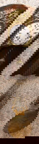 19TH CENTURY FRENCH WAG ON THE WALL RELIEF CLOCK: A wonderful wall clock with custom shelf. Wall mount shelf is 34 by 13 inches. Clock box is 10 by 10 inches. Brass relief motif of farming is 10 by 15 inches. Pendulum is 40 inches long. Enamel face.