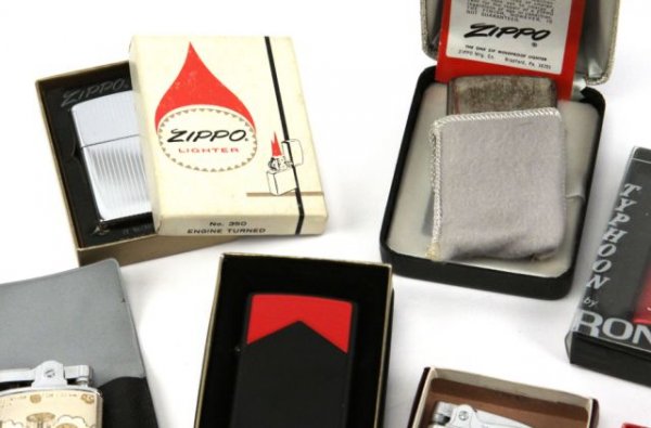 25 PLUS CIGARETTE LIGHTER COLLECTION ZIPPO RONSON: A grouping of over 25 cigarette lighters most are mint and in original boxes, Zippos, Ronson, Regent, and others several advertising a useful lot.