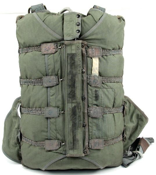 COMPLETE PARACHUTE IN PACK: Military parachute still stuffed in pack with all harnesses and rip cord. Would require thorough inspection by certified professional before use.