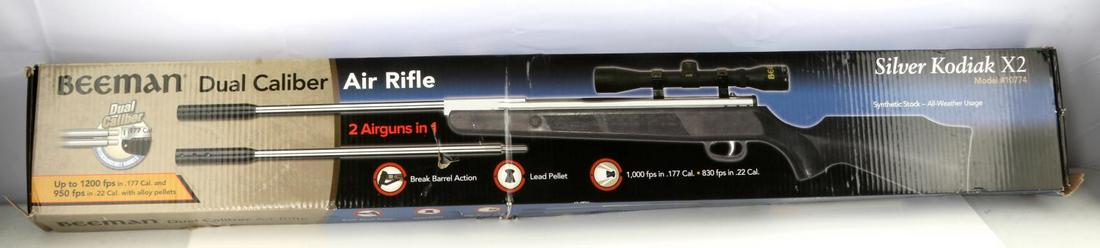 BEEMAN DUAL CALIBER SILVER KODIAK X2 AIR RIFLE: 2 airguns in 1, 4 X 32 scope and mounts, synthetic stock, satin nickel barrel and receiver, ported muzzle brake. Disassembled and in original box. Very good condition. No international shipping.