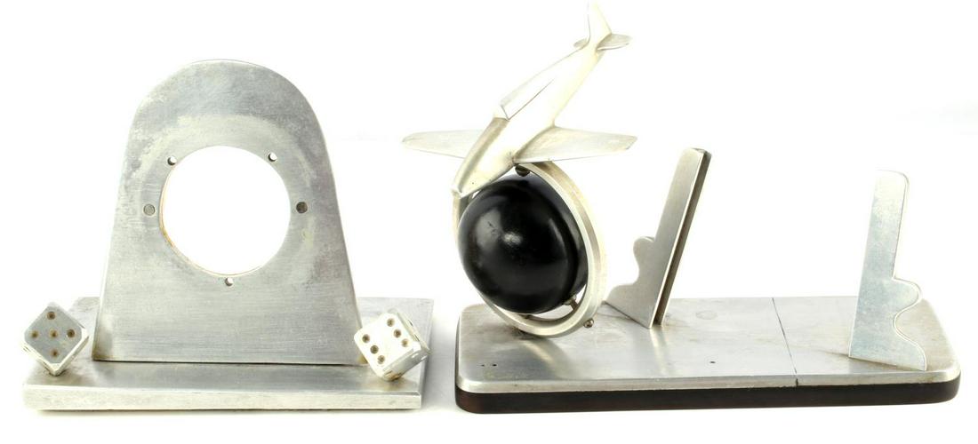 WWII TRENCH ART FIGHTER & DICE PICTURE FRAME: Interesting design, aluminum on hard rubber base, measuring 8 by 7 by 3 inches, no markings or signatures, the second an oval frame with dice at base 7 by 6 by 4.