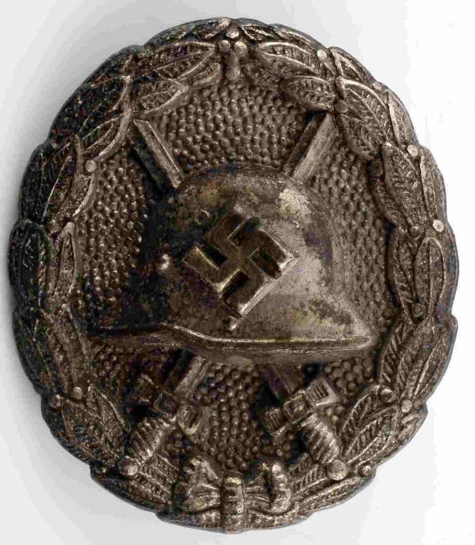 WWII GERMAN CONDOR LEGION SILVER WOUND BADGE: This is a Spanish Civil War Condor Legion silver grade wound badge. Stamped nickel construction and thin reverse pin. Very good condition overall with some light patina and service wear present. 1 3/4