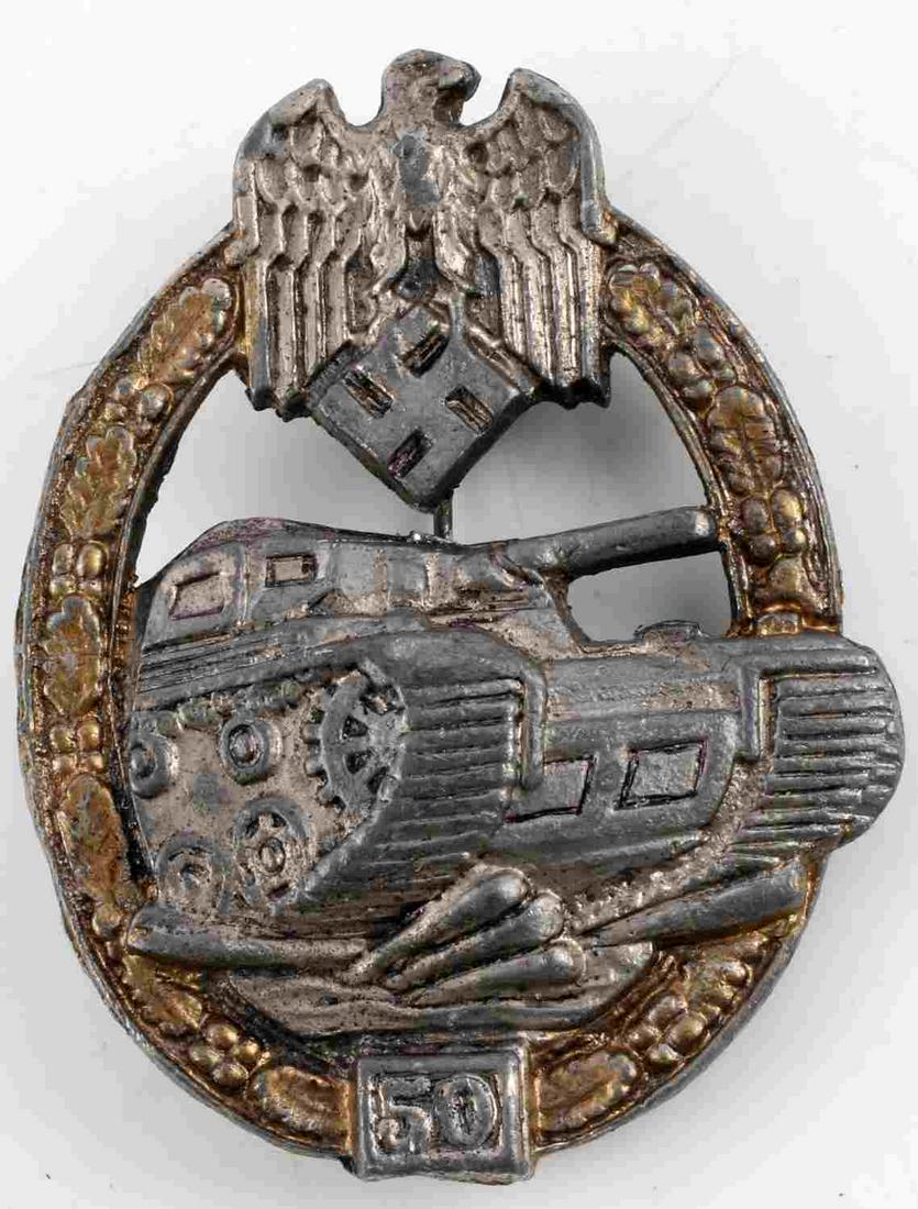 WWII GERMAN THIRD REICH PANZER 50 ASSAULT BADGE: Third Reich Panzer assault badge for 50 assaults. Oak leaf wreath with tank. Vertical pin with C catch. Measures 2 1/2 inches. Good condition. Unauthenticated, sold as is.