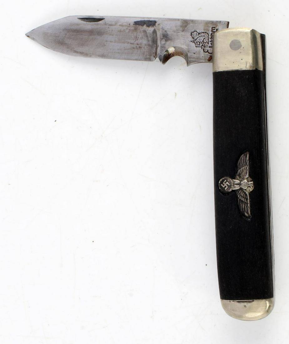 WWII THIRD REICH GERMAN FOLDING POCKET KNIFE: Single blade measures 2 inches, Eickhorn marked, wood grips, steel fittings, and German eagle inlay. Very good condition. Unauthenticated, sold as is. This lot has a reserve.