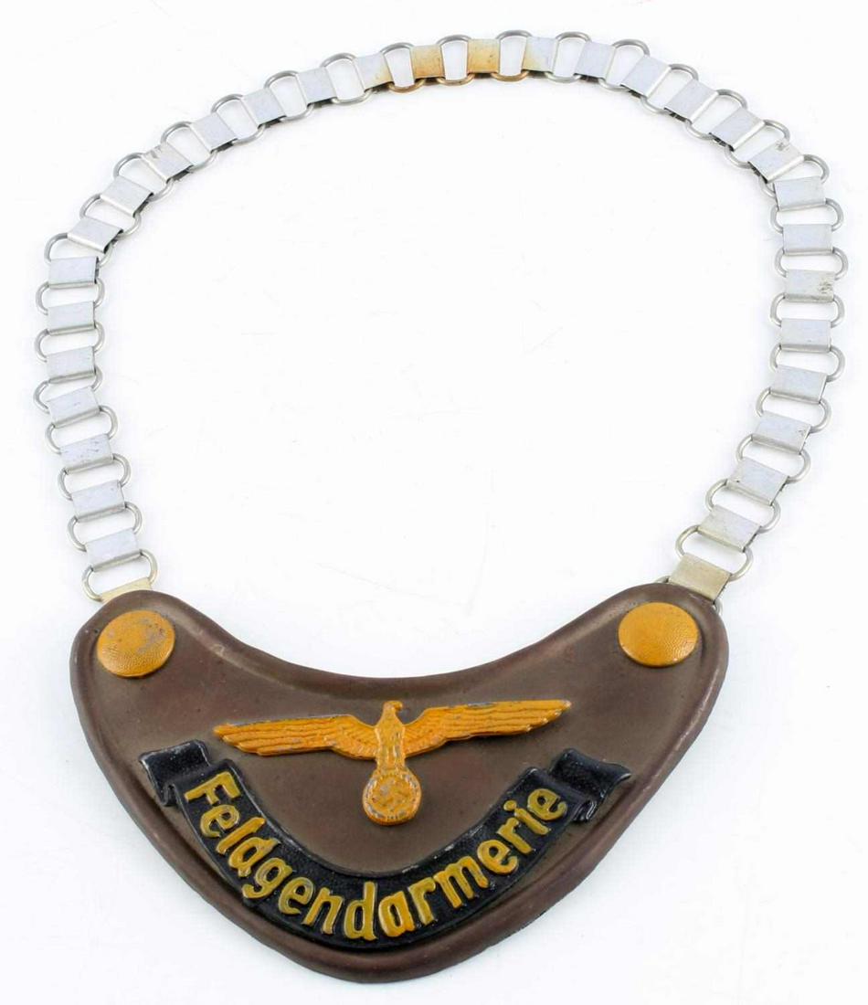 WWII GERMAN REICH FELGENDARMERIE GORGET & CHAIN: WWII German Reich Feldgendarmerie gorget & chain in good condition. Measures 6 3/4 inches wide. Unauthenticated, sold as is.