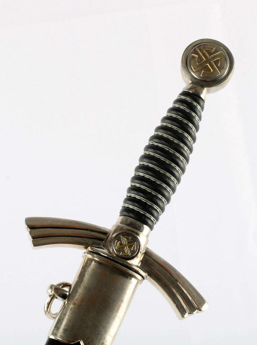 WWII THIRD REICH GERMAN 1ST MODEL LUFTWAFFE DAGGER: Features a 12 1/8 inch blade, aluminum fittings, wire wrapped grip, leather and metal scabbard. Some wear to scabbard, blade is very good. Washer is absent. Unauthenticated, sold as is. Unknown maker.