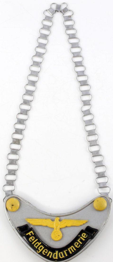 WWII GERMAN THIRD REICH FELDGENDARMERIE GORGET: Third Reich Feldgendarmerie gorget. Paint does not glow in the dark or under UV light. Gorget is magnetic. Measures 6 1/4 inches. Unauthenticated, sold as is.