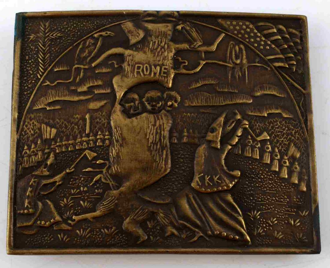 VINTAGE BRASS KU KLUX KLAN KKK BELT BUCKLE: Brass KKK belt buckle measuring 3 x 3 1/2 inches approximately. Reverse is embossed with eagle and "Warranted Finest Minted Brass" and the maker mark "Daniel Low & Co Salem Mass Witch" with image of w