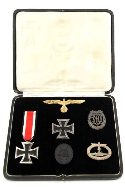 GERMAN WWII U-BOAT LTzS KARL R BELZ MEDAL GROUPING: An important grouping of medals named to LT. zur See Karl-Robert Belz. Medals listed are stored/displayed in a period black leatherette case with silk inside lid and velvet lower. Medals included are:
