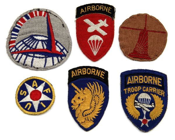 WWII AIRBORNE & AIR TRANSPORT ORIGINAL PATCH LOT: A group of original WWII Airborne and transport patches consisting of the following: 13th Airborne, Airborne Troop carrier white back, Army Air Transport Command embroidered back, Army Air Force Instr