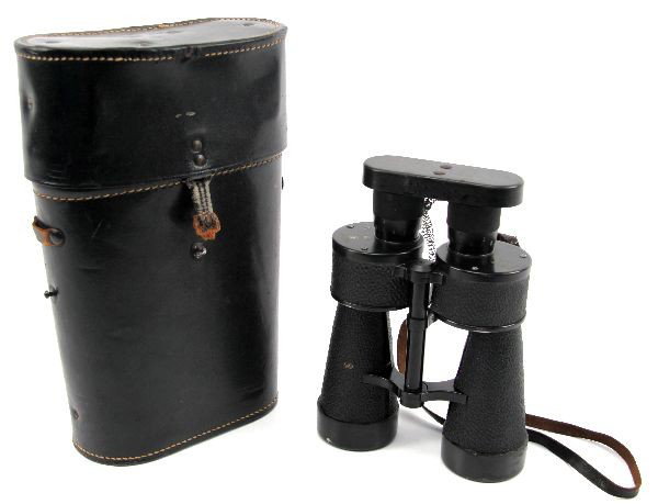 WWII KRIEGSMARINE ARTILLERY BINOCULARS & CASE: A pair of Kriegsmarine Artillery Binoculars in near mint condition with optic covers, range finder in right eye piece, BEH 7x50 Eagle above M on optics as well as case along with BEH 1942 on case as w