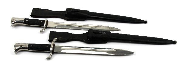 WWII GERMAN DRESS BAYONET AND DRESS DAGGER: WWII German dress bayonet with scabbard and leather frog. Clean blade marked at ricasso "Original Eckhorn Solingen" with squirrel logo. Also, German WWII dress dagger with scabbard and frog, also mark