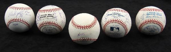5 SIGNED BASEBALLS BOGGS PLUS TEAM SIGNED BALLS: Included is a signed and hand numbered 12/26 "HOF 2005" Wade Boggs ball with 2 holograms. Also included is a ball signed by Yogi Bera and 22 others, possibly a 1986 Mets ball, a Yankee signed ball inc
