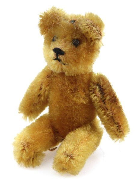 SCHUCO JANUS 1954 TEDDY BEAR 2 FACE MOHAIR: A rare Janus, after the roman two faced god. Schuco 3.5 inch mohair over metal construction fully jointed bear. Very good condition with minimal detractions, knob at base revolves head 360 degrees.