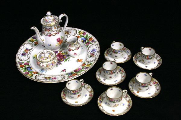 SCHUMANN BAVARIAN PORCELAIN DEMITASSE TEA SERVICE: 16 Piece set of Schumann Bavarian porcelain. Pieces include: a 13 inch platter, a 7.5 inch lidded teapot, a 3.5 inch, creamer, a 3 inch lidded sugar, (6) 4.25 inch demitasse plates, and (6) 2 inch dem