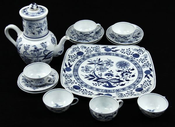 MEISSEN BLUE ONION PORCELAIN TEA SET: 11.5 inch tray, 5 inch tea pot with 4 inch strainer, six 2 inch tea cups, two 4.75 inch saucers, four 5.25 inch saucers. All pieces are properly marked and in very good condition with minimal wear.