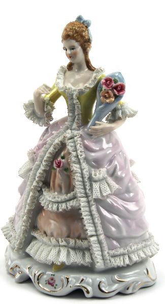 VINTAGE KRISTER KPM PORCELAIN FIGURINE: A fine lady with flower bouquet. Lots of frill. KPM mark on bottom. Very good condition with no losses noted.