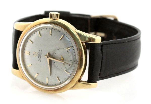 VINTAGE MENS 18K OMEGA AUTOMATIC WRISTWATCH: Movement: automatic; 17 jewels Case: 34mm 18K gold Band: Adjustable calfskin leather Omega band Face, Dial, Hands: Silver dial with gold baton numerals and inset second auxiliary. Weight: 43.7 g Condi