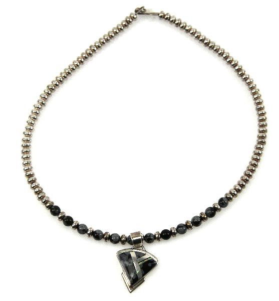 NAVAJO SIGNED FRANCISCO STERLING OBSIDIAN NECKLAC: Navajo sterling silver bead necklace with snowflake obsidian beads and pendant. Signed "Francisico A sterling" on back of pendant. . Size: 16 inches . Weight: 37 g . Condition: Very good