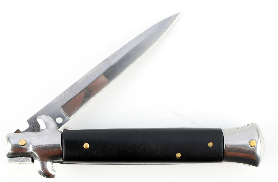 ITALIAN MADE AKC SWITCHBLADE KNIFE BLACK CELLULOID: AKC knife with stainless steel blade, black celluloid grip, and brass accents. Measures 9 inches. Very good condition.