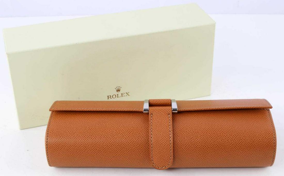 ROLEX LEATHER WATCH ROLE WITH CHROME BUCKLE: Leather watch roll case. Single stitched. Chrome buckle. Foam insert. Measures 9 7/8 inches.