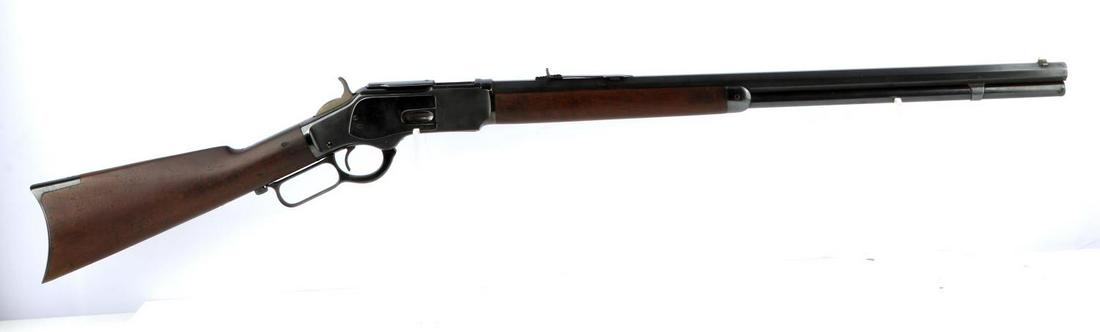 WINCHESTER 1873 LEVER ACTION RIFLE .38 WCF: Manufactured in 1891. Rifle has been re-blued. Features 24.5 inch octagon barrel with fair bore, some rifling left, maker and caliber marked to top barrel flat, serial number to lower tang, caliber ma