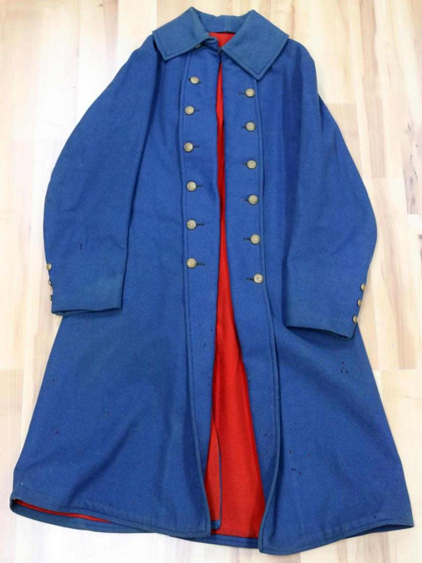M1895 USMC MARINES SPANISH AMERICAN WAR GREAT COAT: Light blue exterior with red lining, high collar, 12 button front, small size, light mothing, small hole inside, otherwise very good original condition.