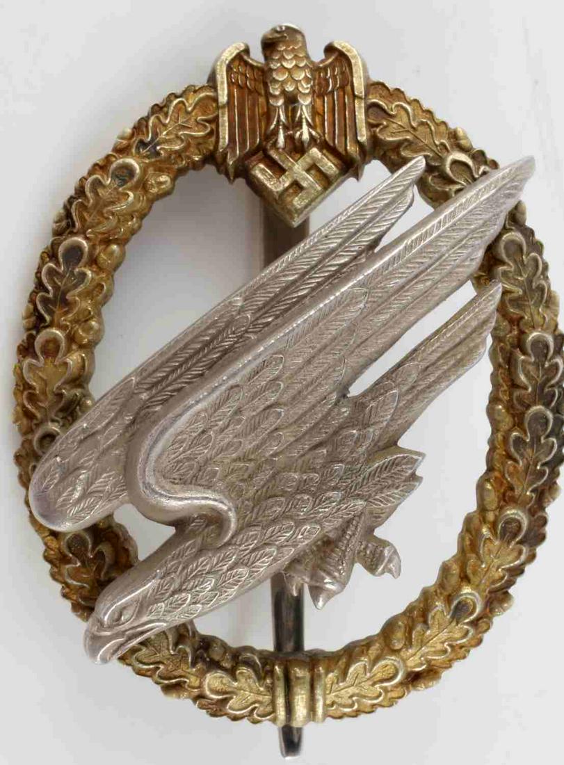 WWII GERMAN SILVER LOCKING PARATROOPER BADGE: German Army Fallschirmjager badge. 1st Pattern made from 800 silver with pin safety catch unique to this type of badge. Hand engraved Obj. Martin Haller A2 Fallschirm inf Btl on reverse. Nice high-dom