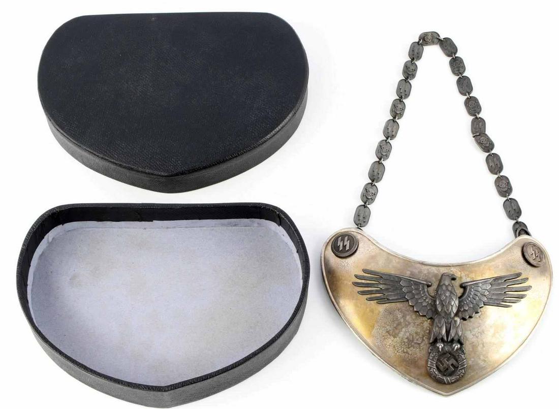 WWII GERMAN REICH SS GORGET & CHAIN & ISSUED BOX: WWII German Reich SS 2nd type gorget, chain, and issue box. Gorget measures about 7 1/2 inches wide. Reverse side possesses forest green cloth backing with three hooks; one of which is marked "RZM M1/