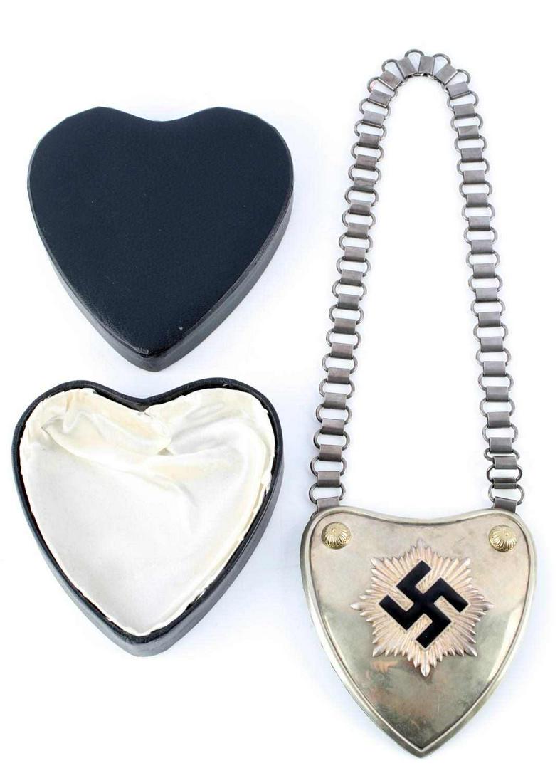 WWII GERMAN REICH RLB 2ND TYPE GORGET IN ISSUE BOX: WWII German Reich RLB 2nd type gorget & chain in original issue box. Gorget measures approximately 5 inches wide by approximately 5 1/2 inches tall. Gorget is in very good condition, with almost no en
