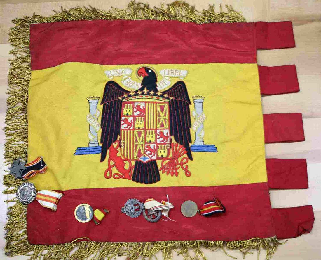 WWII GERMAN REICH SPANISH CONDOR LEGION FLAG: Third Reich Spanish Condor Legion flag with medals and badges. Measures 18 inches without fringe. Medals are the Military Merit Medal which was awarded for exceptional valor. The Spanish volunteer div