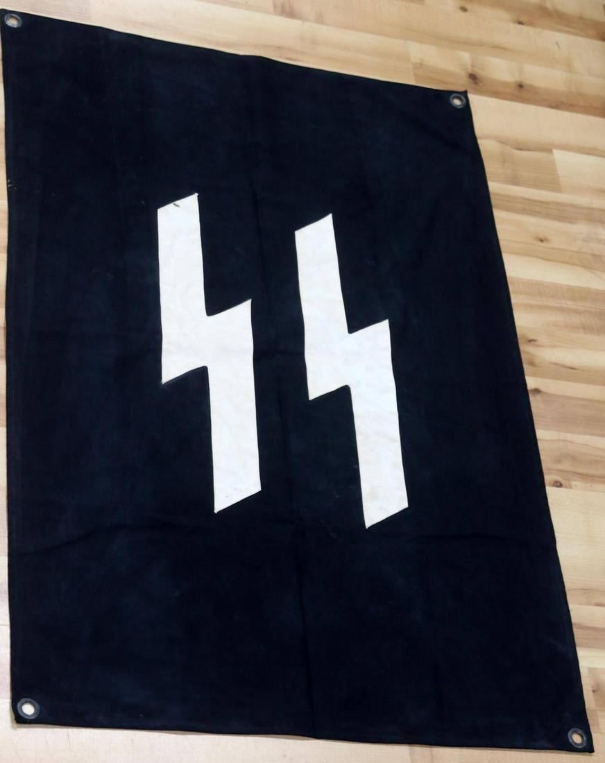 WWII GERMAN SS AERIAL ID BANNER PANZER VEHICLES: White SS runes sewn over black cloth, grommet at each corner. 46 X 30.5 inches. Very good condition. Does not fluoresce under blacklight. This lot has a reserve.