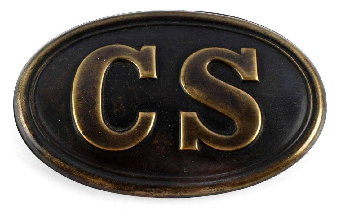 CIVIL WAR ERA CONFEDERATE STATES CS BELT BUCKLE: Confederate States Civil War Enlisted Mans Belt Buckle. Measures 3 1/2" wide by 2 1/8” inches tall. The front reads ‘CS’. There are three flat prongs on the reverse side. Stamped brass construct