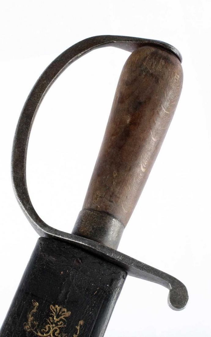 CONFEDERATE STATES CIVIL WAR D GUARD SHORT SWORD: Measures 23 1/8” long overall. The steel blade is maker marked and dated â€˜Macon Arsenal 1861â€™. It measures 1 3/4” wide by 17 1/2" long. Includes the brown leather scabbard tha
