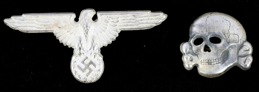 WWII GERMAN SS SCHUTZSTAFFEL VISOR CAP EAGLE SKULL: German WWII Waffen SS Schutz Staffel Officers Visor Cap Eagle & Skull. The eagle measures 2 3/4” wide by 1 1/4” tall. The front shows a Waffen SS spread winged eagle clutching a swastika in his ta
