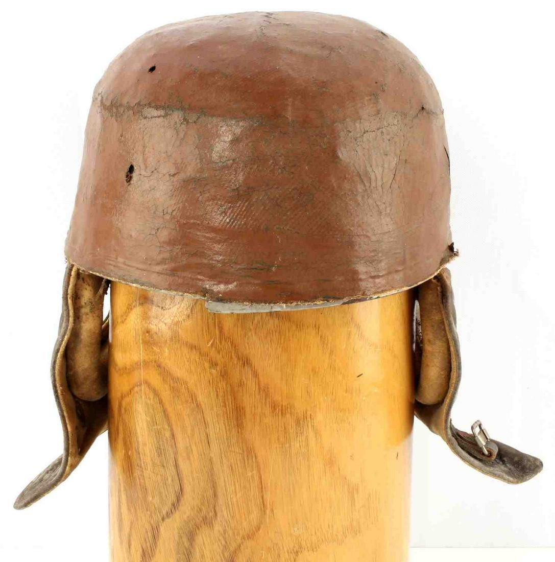 WWI PILOTS FRENCH OR GERMAN CRASH HELMET: WWI French or German pilot's or possible tanker's "crash" helmet in good condition. Flaps present with no tears. Exterior of helmet is in good condition with many rips and tears in upper layer of fabr