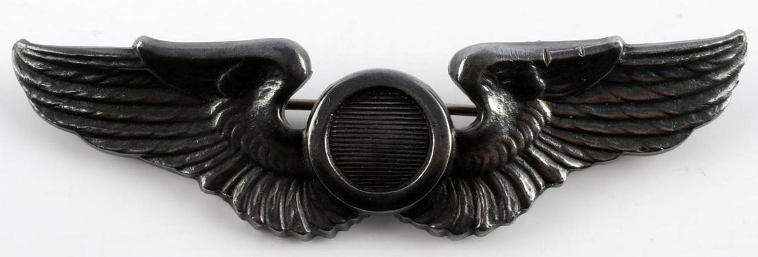 WWII US PILOT OBSERVER WINGS STERLING SILVER: WWII United States Pilot observer wings made of sterling silver feature a thin horizontal pin to the reverse. Reverse marked Sterling. Tested silver. 25.1 grams. Very good condition.