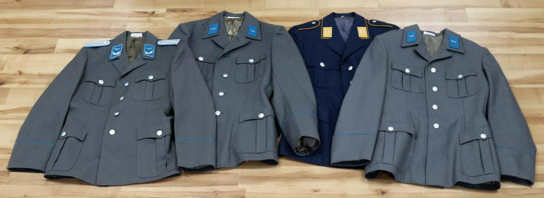 4 EAST GERMAN LUFTWAFFE TUNIC PRIVATE OFFICER LOT: Lot of 3 East German Luftwaffe tunics. One blue Major Air Force dress tunic with Major collar tabs. Size 12. Pocket tag dated 1974. One gray enlisted man tunic with Private rank collar tabs. Size G48.