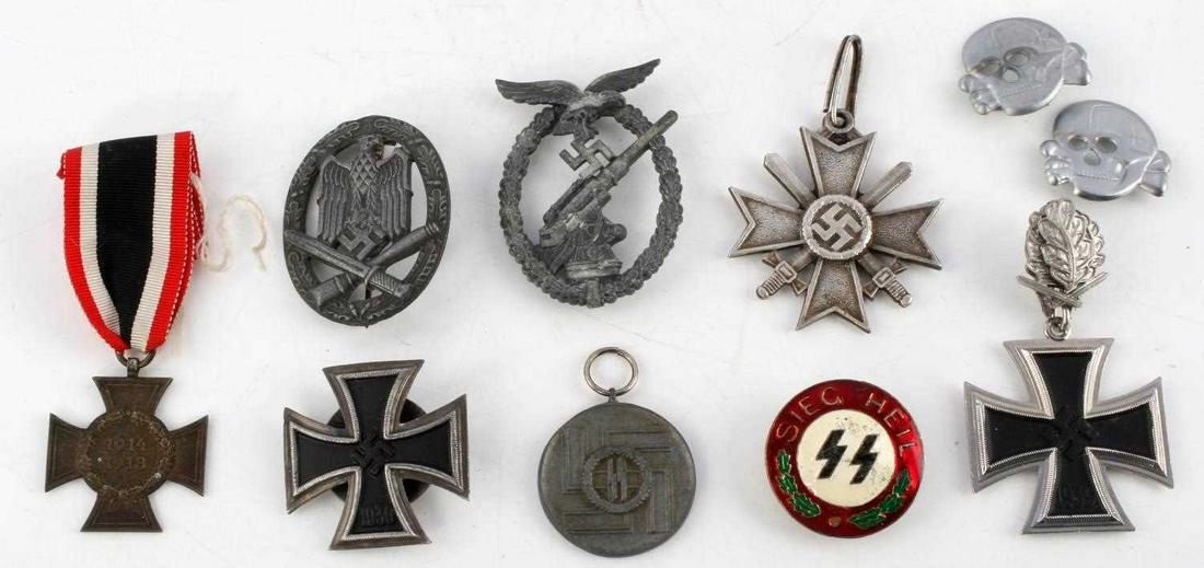 WWII GERMAN BADGE MEDAL INSIGNIA LOT OF 10: Lot includes: General Assault badge, Luftwaffe Flak Artillery badge, silver Merit Cross 2nd class, SS service medal, Iron Cross with oak leaf, Iron Cross with screw-back (RZM), Sieg Heil enamel SS bad