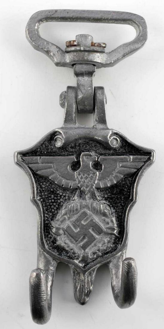 WWII GERMAN REICH POLIZEI PARADE DRUM HANGER: WWII German Reich Polizei parade drum hanger in good condition reading "DRGM" on reverse. Hinged loop on top in good condition. Unauthenticated, sold as is.