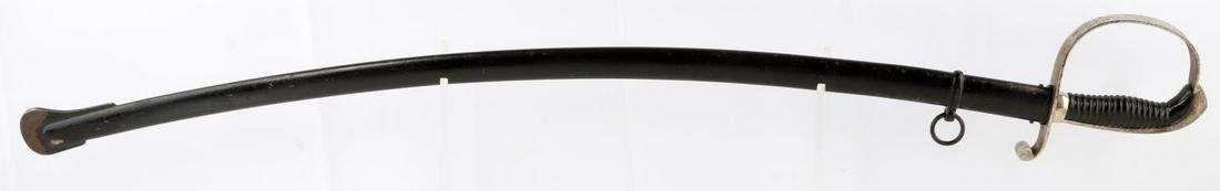 WWI BAVARIAN OFFICER ARTILLERY SABER IN TREUE FEST: W.K&C. Maker stamped at ricasso, In Treue Fest etched on both sides of blade, very good blade, some surface rust to grip, some paint loss to scabbard but dent free, measures overall in scabbard 39 inc