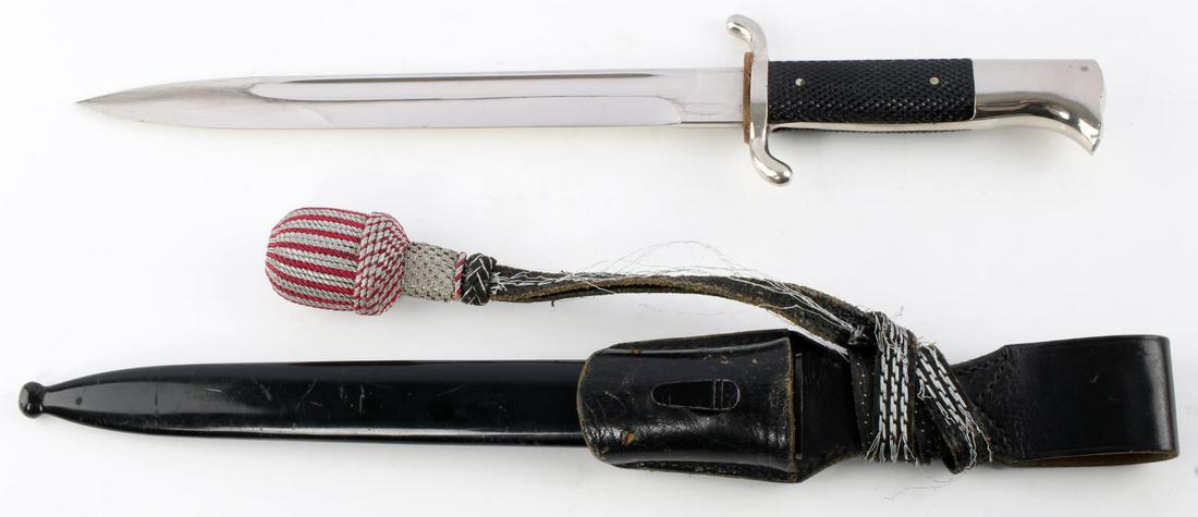 WWII GERMAN FIREMAN WALKING OUT BAYONET W PORTAPEE: Near mint blade and Bakelite grip, some scratching to scabbard and fraying to portapee, A very good example.