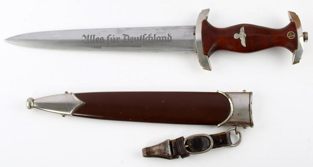 WWII GERMAN THIRD REICH LATE WAR PERIOD SA DAGGER: WWII German Eickhorn SA dagger and scabbard, measures 14 3/4 inches in scabbard. Obverse of blade is etched with "Alles Fur Deutchland." Reverse marked RZM M7/12. Blade fits very tight in scabbard wit