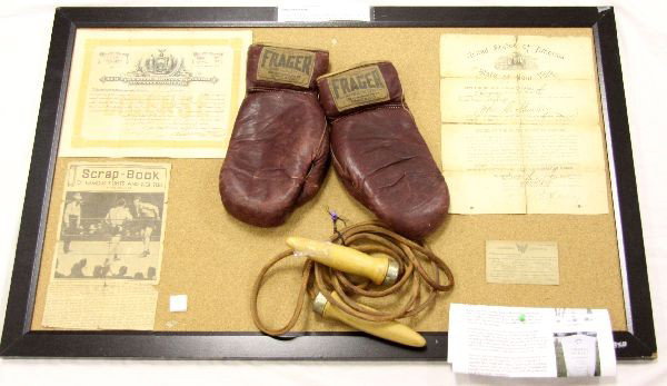 JOHN SHARKEY ORIGINAL BOXING ARCHIVE 1899 -1921: A grouping of historical boxing artifacts belonging to John Sharkey (1873-1953), including his 1921 Boxing license, immigration papers, gloves, jump rope and news paper article of his direct relative 