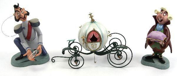 DISNEY FIGURINES ELEGANT COACH GRAND DUKE FOOTMAN: A collection of 3 Disney porcelain figurines from the Cinderella movie. Pieces include: An Elegant Coach for Cinderella, Presenting the Glass Slipper Footman # 1204011, and a Royal Fitting Grand Duke