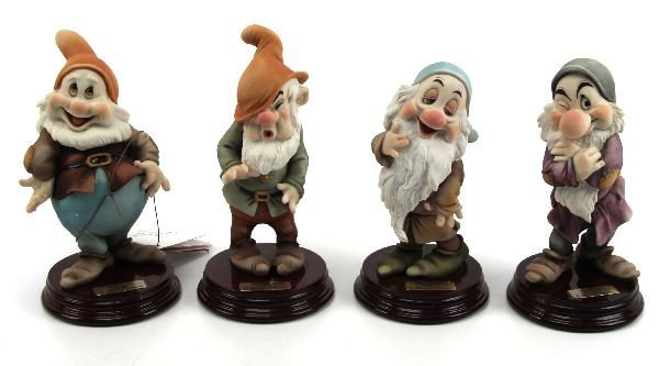 ARMANI HAPPY SNEEZY SLEEPY GRUMPY FIGURINE LOT: A collection of 4 Giuseppe Armani porcelain 7 inch Disney figurines from the movie Snow White, including: Sneezy, Happy, Grumpy, and Sleepy. Very good condition with original boxes.