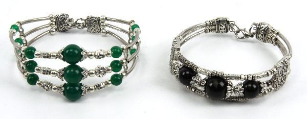 LADIES STERLING JADE & OBSIDIAN BEAD BRACELETS: A pair of ladies sterling silver fashion bracelets with jade and obsidian beads. . Size: 7 inches . Weight: 46.0 g . Condition: Very good