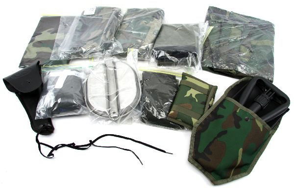 LOT OF MILITARY SURPLUS ITEMS UNUSED CONDITION: Lot of military surplus items. Includes tri fold shovel, 2 mosquito nets, US military .45 holster, signal mirror, storage bag, survival blanket, large woodland camo helmet cover, poncho, and clam shel