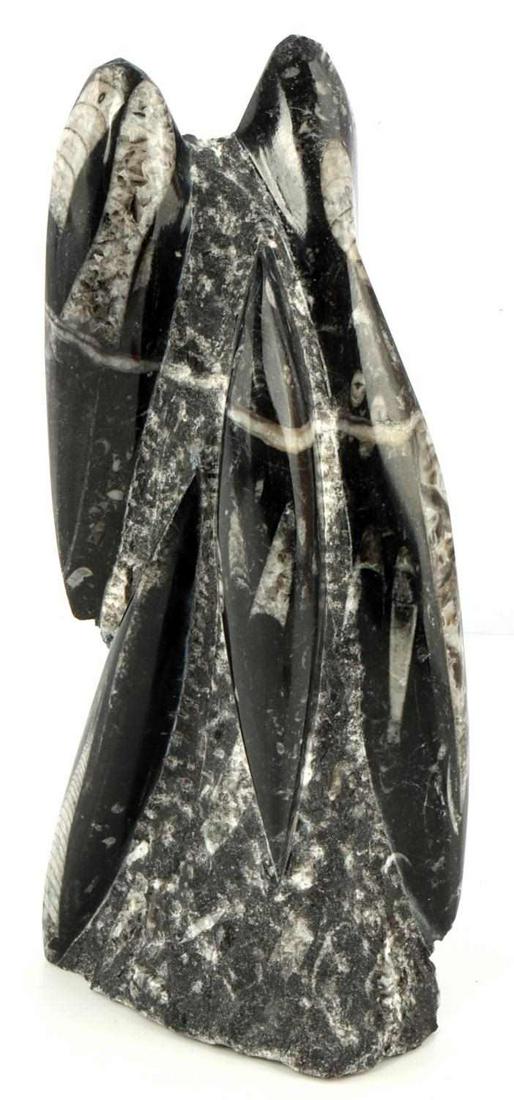 ANCIENT CEPHALOPOD ORTHOCERAS FOSSIL SCULPTURE: Orthoceras fossil sculpture, dating to from 350 million to 400 million years ago. Fossil column has multiple cephalopod fossils carved from the dark gray stone matrix, 9 1/4 x 4 x 2 inches.