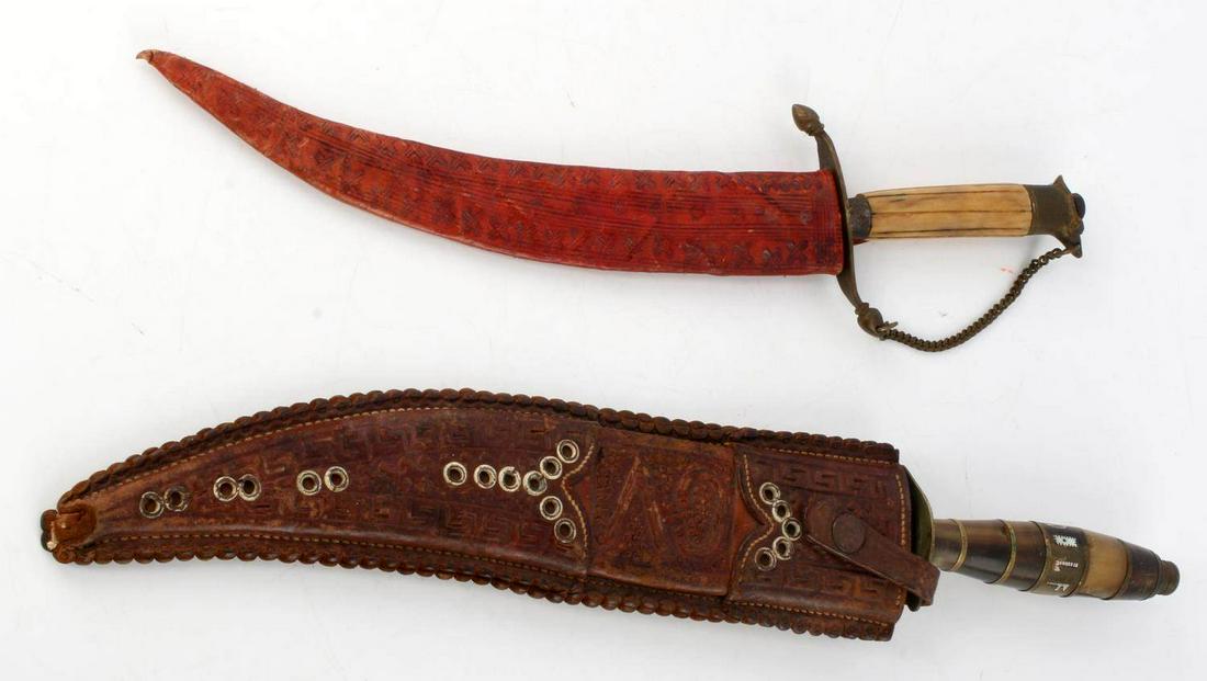 CURVED BLADE KNIFE LOT OF 2 IVORY VICTORY W SHEATH: One ivory grip cutlass knife with brass fittings and chain, marked Victory to ricasso, marked Firesteel to other side, 7.75 inch blade (straight measurement), with red tooled leather sheath. One SW st